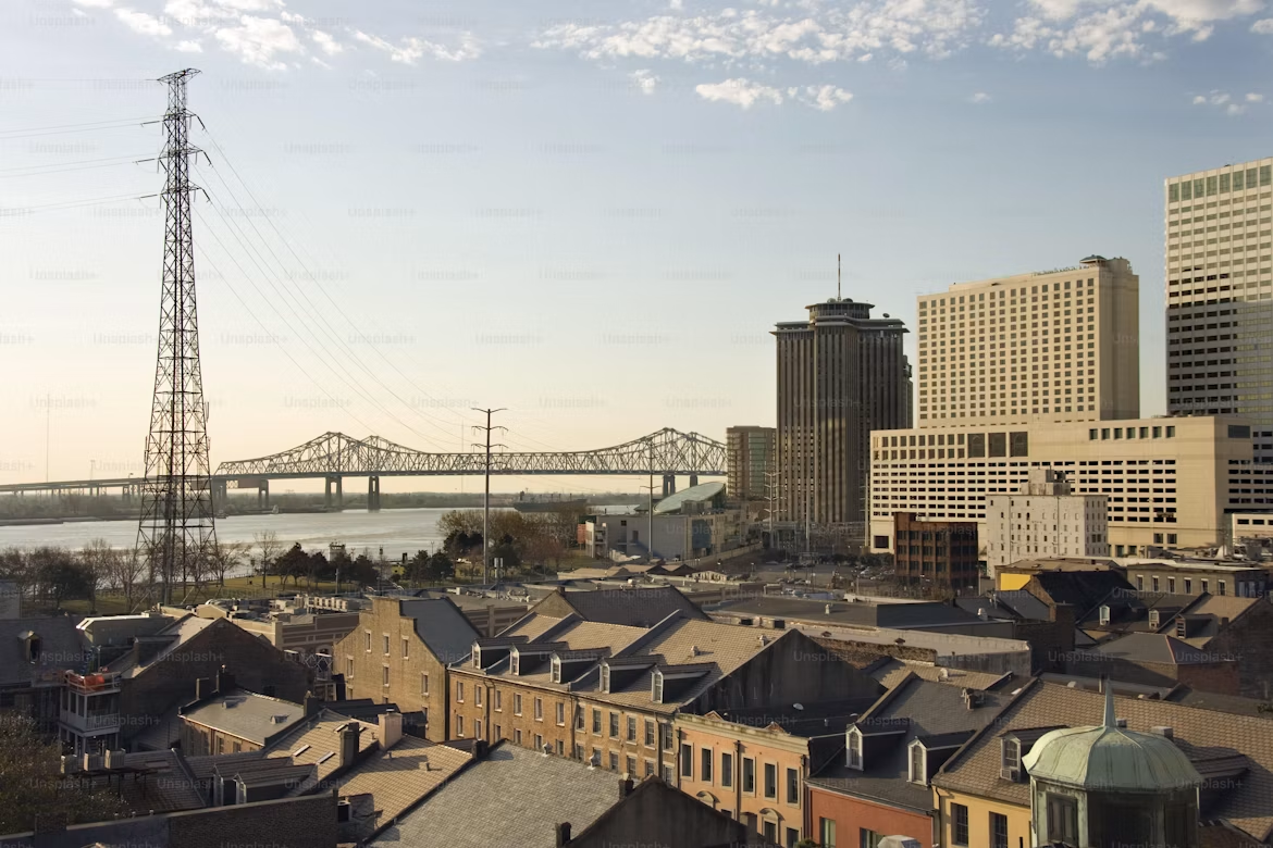 New Orleans cityscape and neighborhood with visible electric transmission infrastructure.